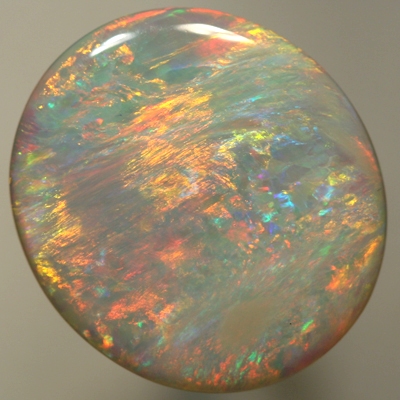 SOLID SEMI BLACK OPAL Bright orange and gold yellow in large rolling flashes. SEE VIDEO